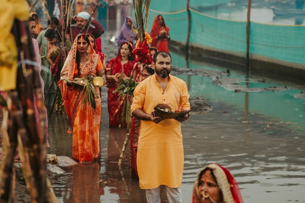 People in traditional indian attire by a river