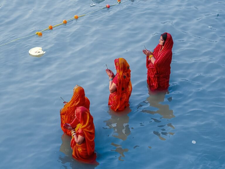 A group of people standing in the water